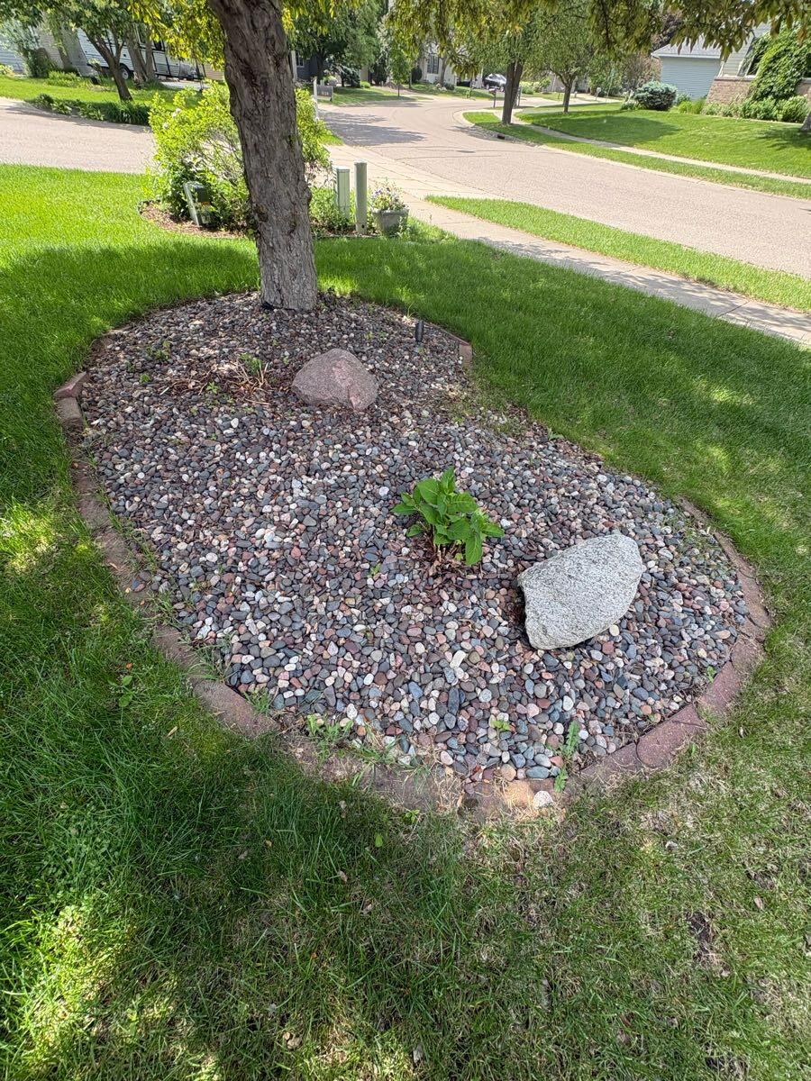 Rock Bed Renovation by Northern Lawn & Landscaping